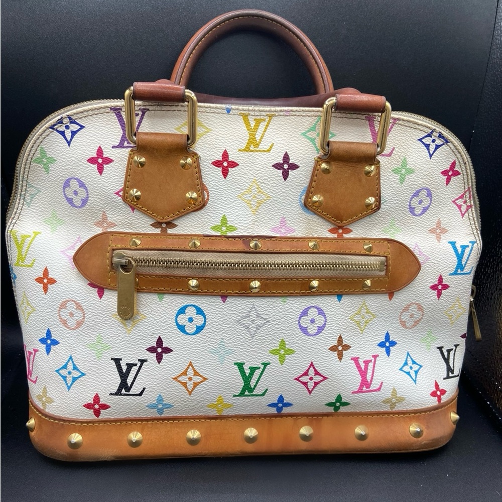 This is an authentic LOUIS VUITTON Monogram Multicolor Alma in White.